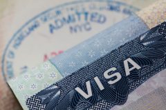 Close up of a Visa spamp in a passport. Immigration and emigration concept